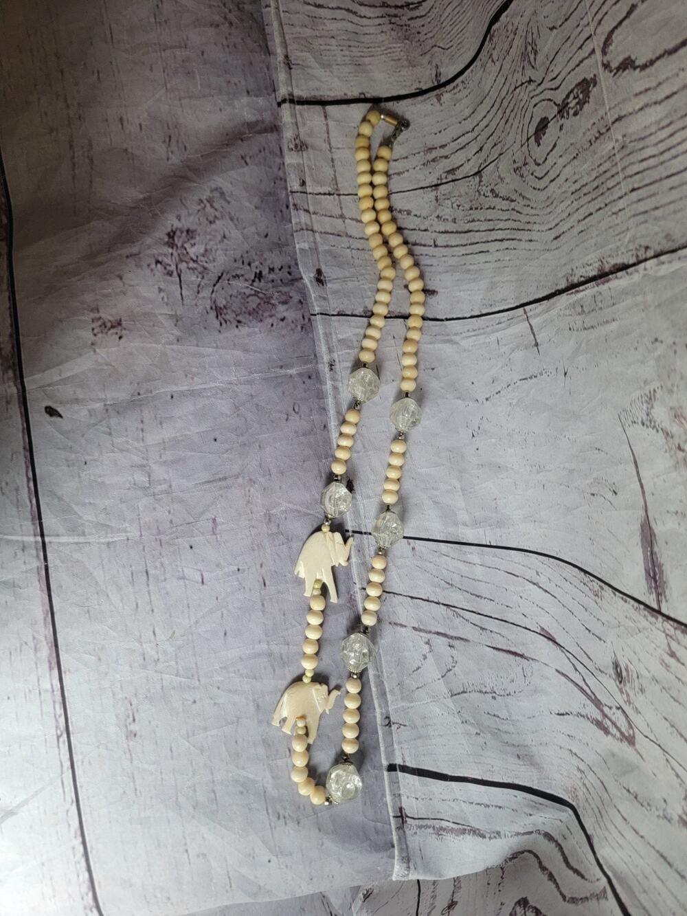 Long Hand Carved Vintage Elephant Necklace 30in Beaded Ivory Colored Clear Bead